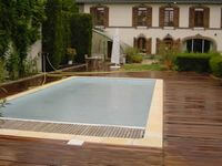 Construction bois revêtement IPE épaisseur 32 mm contour piscine